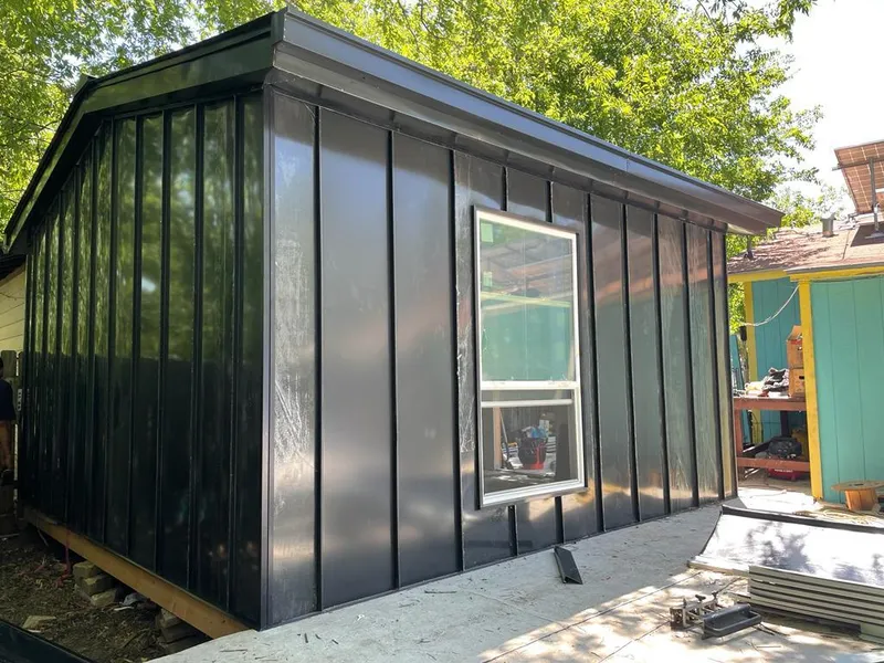 Black standing seam metal wall panels for Roof Inspection in Fair Haven